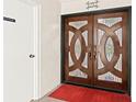 Elegant front door featuring a stained glass design, adding a touch of sophistication and charm at 5701 Mariner St # 606, Tampa, FL 33609