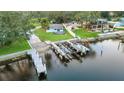 Aerial view showing the property's location with a private dock and boat lift for easy boating access at 10501 Bridgewood Dr, Riverview, FL 33578