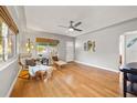 Bright living room with hardwood floors, modern ceiling fan, and a comfortable seating area at 1818 53Rd S St, Gulfport, FL 33707