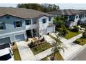 Aerial view of a lovely community with well-maintained lawns, driveways and garages, offering ample parking and curb appeal at 3808 Cat Mint St, Tampa, FL 33619