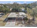 Aerial view of a brick home featuring fenced yard with covered parking at 3817 N 54Th St, Tampa, FL 33619