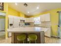 Bright kitchen with white cabinets, spacious countertops, and stainless steel appliances at 7301 Avocet Dr, Wesley Chapel, FL 33544