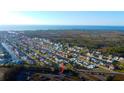 An aerial view showing the home's proximity to the water and neighborhood layout at 7623 Mako Dr, Hudson, FL 34667