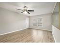 Bright living room with neutral walls, ceiling fan, and hardwood floors at 7802 Hardwick Dr # 1117, New Port Richey, FL 34653