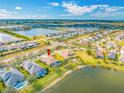 Aerial view of home's location on the lake with community and neighborhood at 833 Seminole Sky Dr, Ruskin, FL 33570