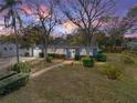 Inviting single Gathering home with mature trees, well-maintained lawn, and charming blue facade at 1213 60Th S St, Gulfport, FL 33707