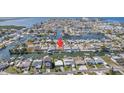 Wide aerial shot of waterfront homes, featuring a canal-front property with boat dock and beautiful water views at 13614 Evelane Dr, Hudson, FL 34667