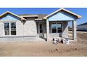 New home construction progress with visible block walls and window installations at 28784 Rambutan Dr, Wesley Chapel, FL 33543