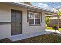 Close-up of the front of home, including door and window at 306 Midwood Dr, Plant City, FL 33566
