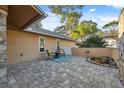 Secluded outdoor patio with paver flooring, comfortable seating and a tranquil garden feature, perfect for relaxation at 3092 Osprey Ln, Clearwater, FL 33762