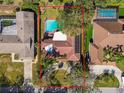 Overhead view of a property that features a pool and a well manicured yard in a vibrant community at 4609 W San Miguel St, Tampa, FL 33629