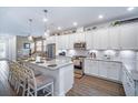 Modern, open kitchen with granite counters, stainless appliances, and lots of counter seating at 5566 Silver Sun Dr, Apollo Beach, FL 33572