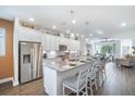 Modern kitchen featuring white cabinets, granite countertops and stainless steel appliances at 5566 Silver Sun Dr, Apollo Beach, FL 33572