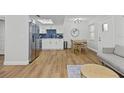 Open-concept living area with modern furnishings and a bright, airy feel at 9895 1St E St # 5, Treasure Island, FL 33706