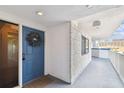 Exterior shot of the unit's front door and porch area with a wreath, creating a welcoming entrance at 2 Adalia Ave # 602, Tampa, FL 33606