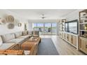 Living room boasts water views, coastal decor, and a comfortable seating area with lots of natural light at 2 Adalia Ave # 602, Tampa, FL 33606