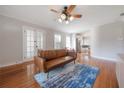 Bright living room with hardwood floors, and access to the kitchen area at 5502 N 9Th St, Tampa, FL 33604