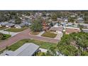 Aerial view of a neighborhood featuring tree-lined streets and well-kept homes with mature landscaping at 5559 17Th N Ave, St Petersburg, FL 33710