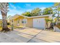 Charming single-story brick home with a well-manicured front yard and attached garage at 7507 Betula Dr, New Port Richey, FL 34653