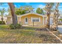 Charming single-story home with a neatly landscaped yard and mature trees at 7507 Betula Dr, New Port Richey, FL 34653