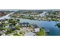 Luxury townhomes are situated on a waterfront lot near boats and other homes at 774 Gran Kaymen Way, Apollo Beach, FL 33572