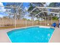 Inviting screened-in pool provides ample space for swimming, recreation, and leisure at 9040 Lunar Ln, Port Richey, FL 34668
