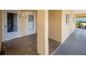 Inviting front entrance showcasing tiled floor and exterior architectural detail at 1125 Pinellas Bayway S # 305, St Petersburg, FL 33715