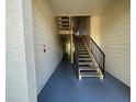 Hallway with staircase leading to the next floor at 11901 4Th N St # 10102, St Petersburg, FL 33716