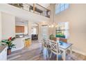 The dining area offers open sightlines to the entry foyer and the kitchen bar seating at 12607 San Blas Loop, Largo, FL 33774