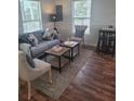 Cozy living room featuring stylish furniture, hardwood floors, and natural lighting at 1321 W North B St, Tampa, FL 33606