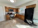 Well-lit kitchen with stainless steel appliances and granite countertops at 1919 E Noel St, Tampa, FL 33610