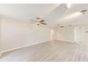 Spacious living room with sleek floors, neutral walls, and modern ceiling fans at 4606 W Oakellar Ave, Tampa, FL 33611