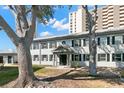 Charming condo building with mature trees and well-maintained landscaping at 6980 Avenue Des Palais # 2A, South Pasadena, FL 33707