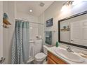 Bright bathroom featuring a tub and shower, a modern vanity, and contemporary fixtures for added convenience at 7325 S Trask St, Tampa, FL 33616