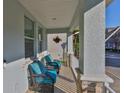 Relaxing front porch featuring comfortable seating, decorative accents, and a welcoming ambiance for residents and guests alike at 7325 S Trask St, Tampa, FL 33616