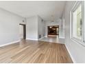 Spacious living room featuring wood floors, neutral paint, and abundant natural light at 969 Britton St, Largo, FL 33770