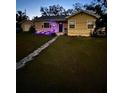 Charming single-story home with a front yard and welcoming entrance at dusk at 2301 46Th S St, St Petersburg, FL 33711