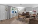 Inviting living room featuring a picture window, plush seating, and ample natural light for a comfortable feel at 4077 Ramona Dr, Spring Hill, FL 34606