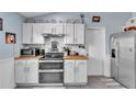 Well-equipped kitchen with stainless steel appliances and butcher block countertops at 5106 Tanner Rd, Spring Hill, FL 34609