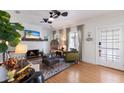 Inviting living room with a fireplace, hardwood floors, and neutral tones throughout at 610 Casabella Dr, Bradenton, FL 34209