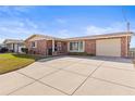 Charming brick home with a well-maintained lawn and inviting curb appeal at 6518 Leeside Isle, Hudson, FL 34667