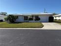 Charming single-story home featuring a well-manicured lawn and inviting curb appeal at 14132 89Th Ave, Seminole, FL 33776