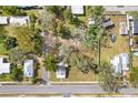An overhead look at this cozy house surrounded by lush trees and foliage at 14329 14Th St, Dade City, FL 33523