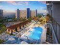 Resort-style pool area with lounge chairs and cabanas, perfect for relaxation and enjoying the ocean breeze at 15000 Madeira Way # 622, Madeira Beach, FL 33708