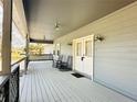 Welcoming covered porch with chairs and ample space, perfect for outdoor seating at 7705 W Four Pines Rd, Plant City, FL 33565