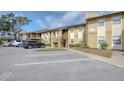 Exterior of a condo building with parking and some landscaping with the unit number clearly displayed at 10195 Sailwinds N Blvd # 101, Largo, FL 33773