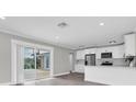 Modern kitchen featuring stainless steel appliances and white cabinetry at 1230 75Th N Ave, St Petersburg, FL 33702