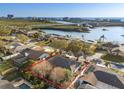 Waterfront home with an expansive view of the bay and bridge, outlined in red on the property at 8083 Bayhaven Dr, Seminole, FL 33776