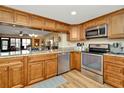 Modern kitchen featuring stainless steel appliances, granite countertops, and ample cabinet space at 1801 E Lake Rd # 11A, Palm Harbor, FL 34685