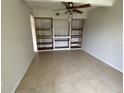 Bright dining area with built-in shelving and tile flooring at 3223 Coats Rd, Zephyrhills, FL 33541